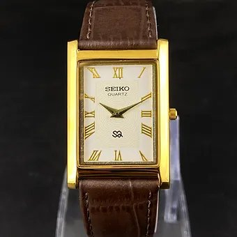 Seiko Slim Rectangular white Face Brown Band Mens watch A0102