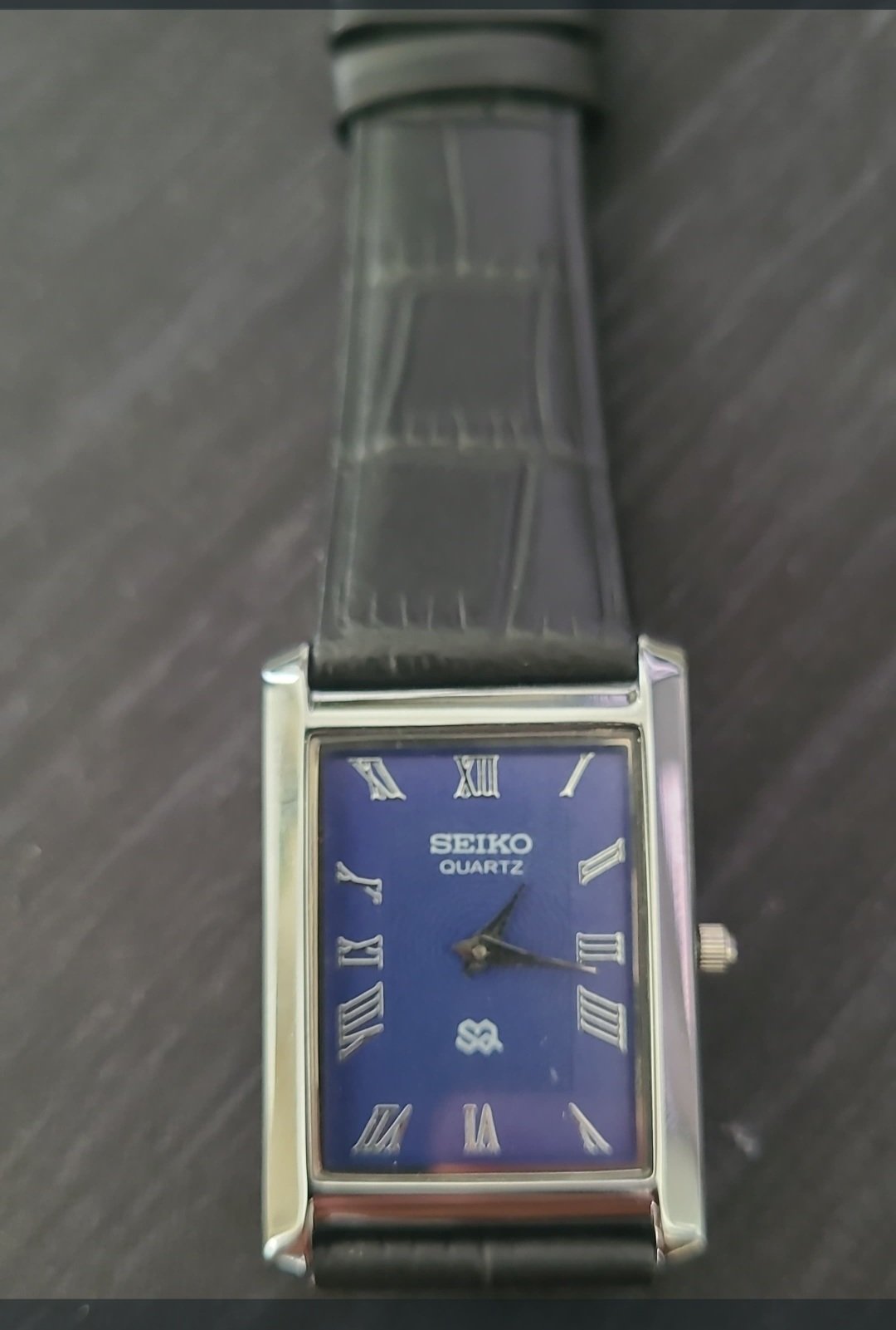 Seiko Slim rectangular Blue face and black strap wrist watch